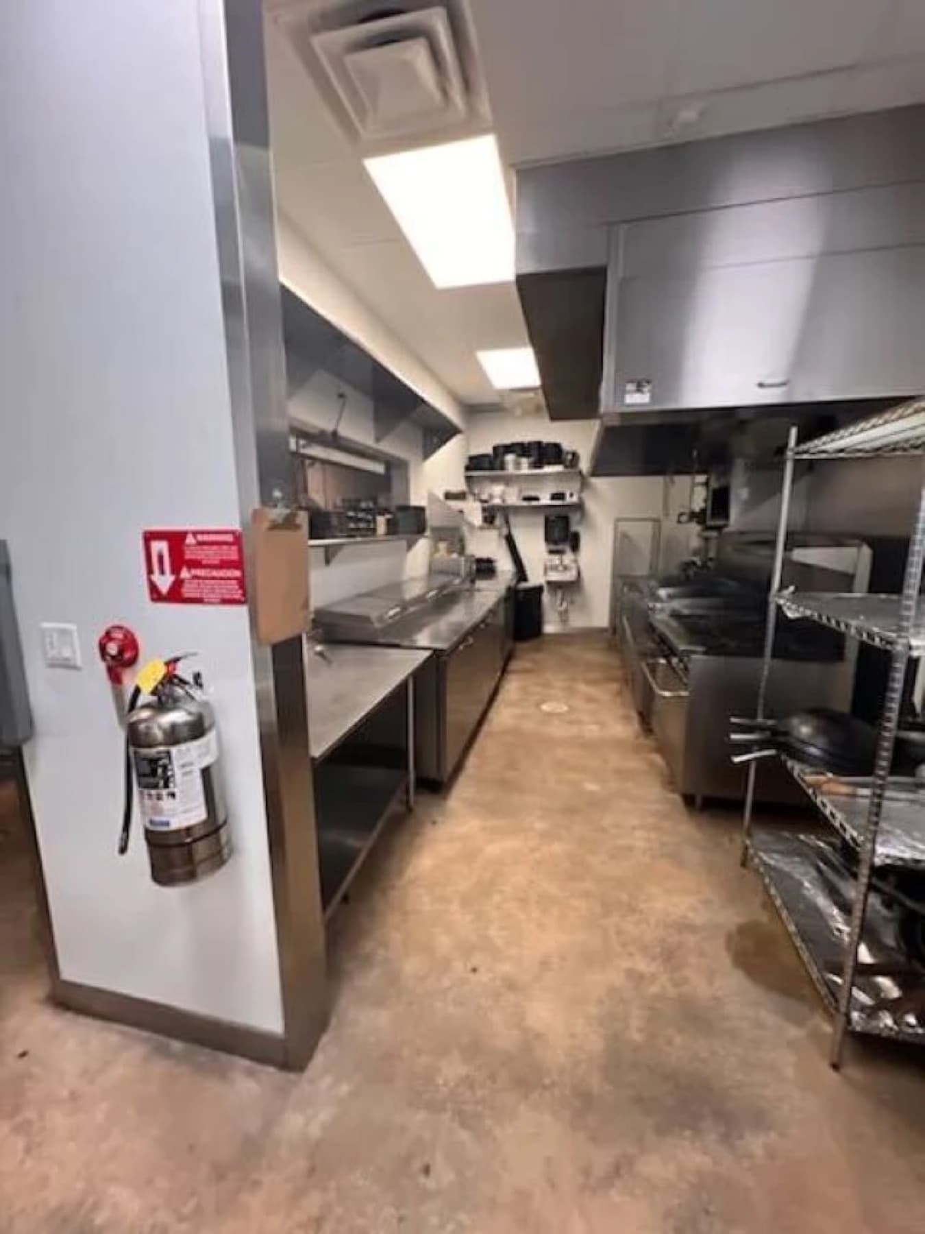 Commercial kitchen floor after degreasing and scrubbing