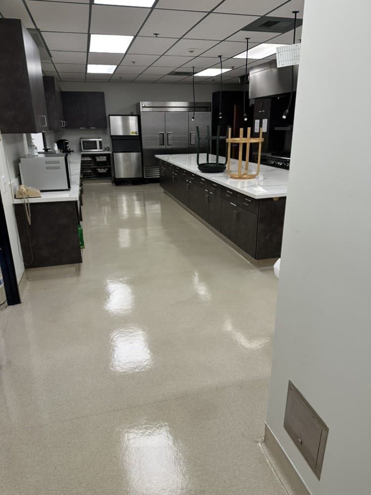 Commercial break-room VCT floor stripped, waxed, and burnished to a gloss