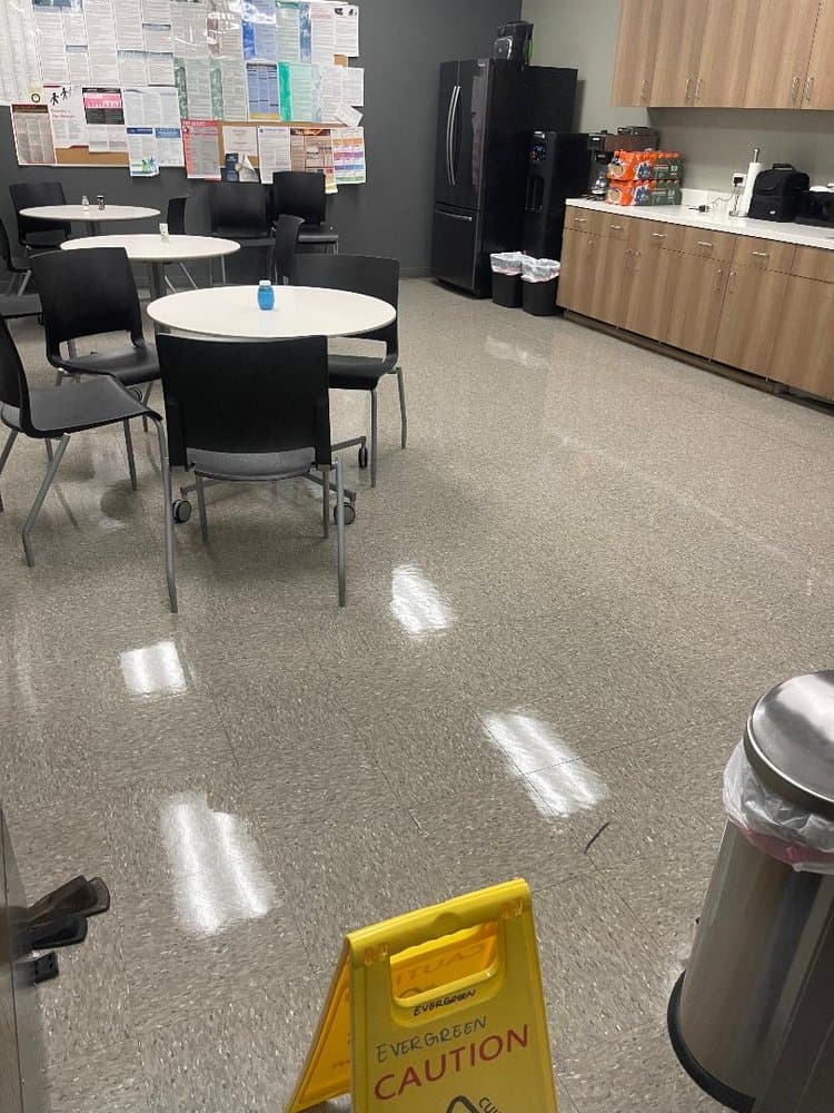 Lunchroom VCT floor freshly stripped and waxed to a shine